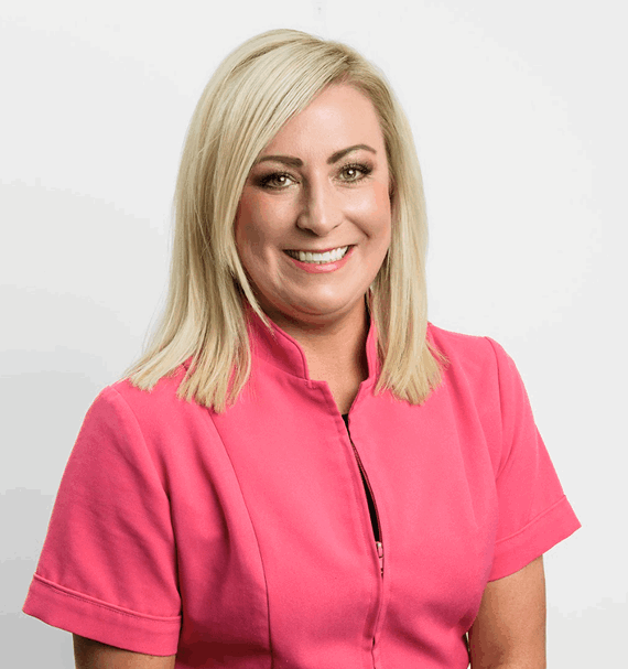 Portrait of Amy Style, Hygienist, smiling in pink uniform
