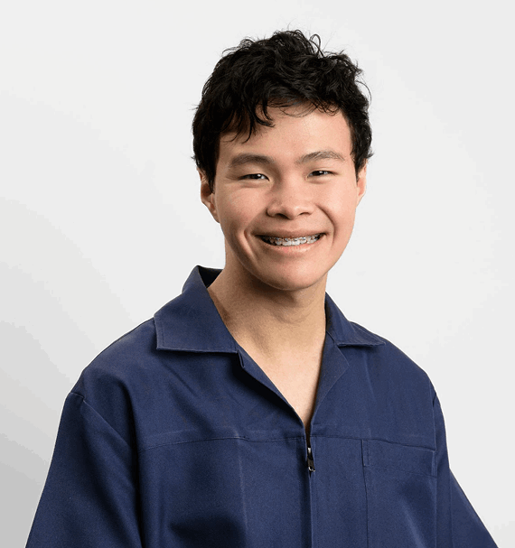 Portrait of Jordan Kat, Dental Assistant, smiling in navy uniform